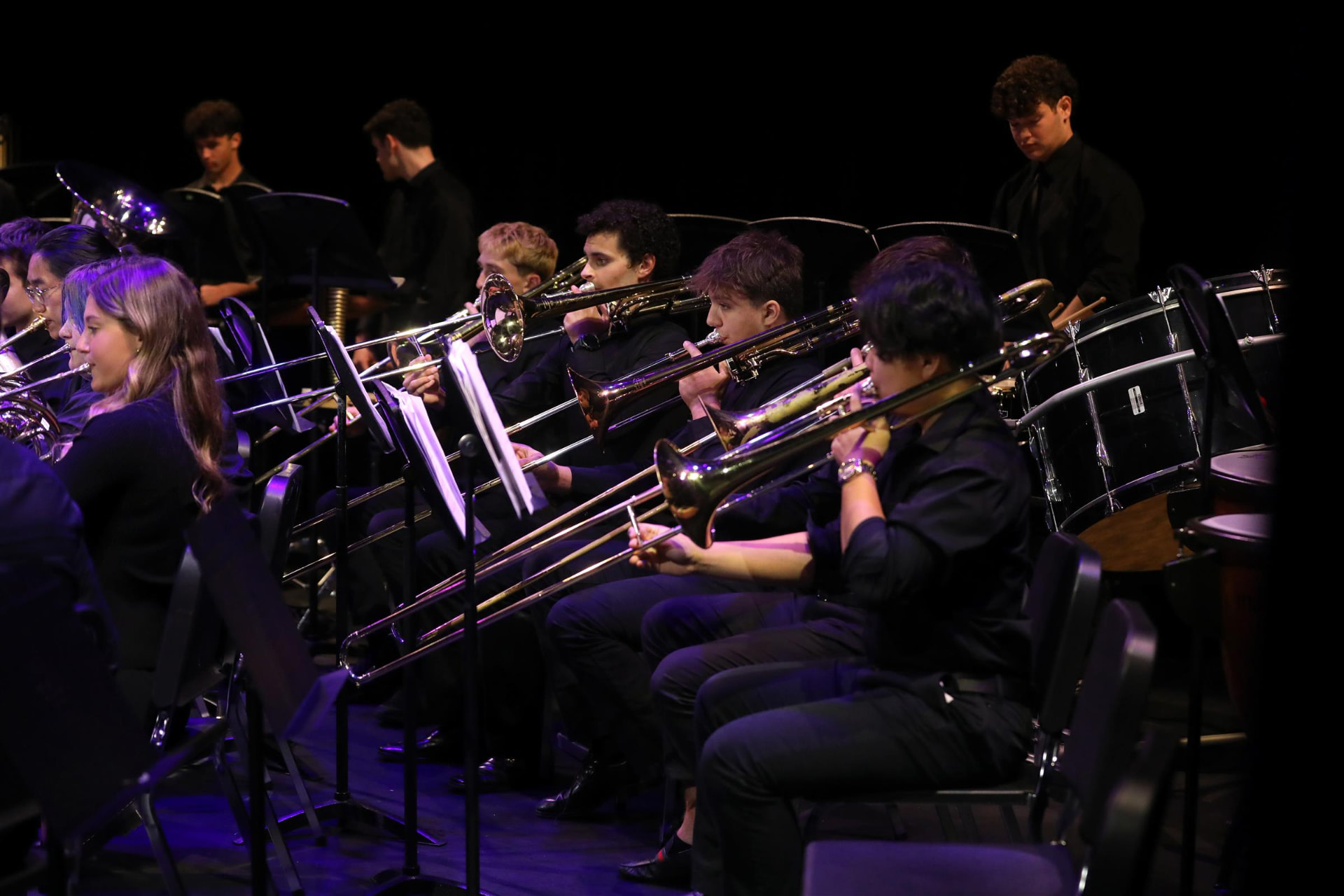 Our founder performing French horn in her high school symphonic band during a concert
